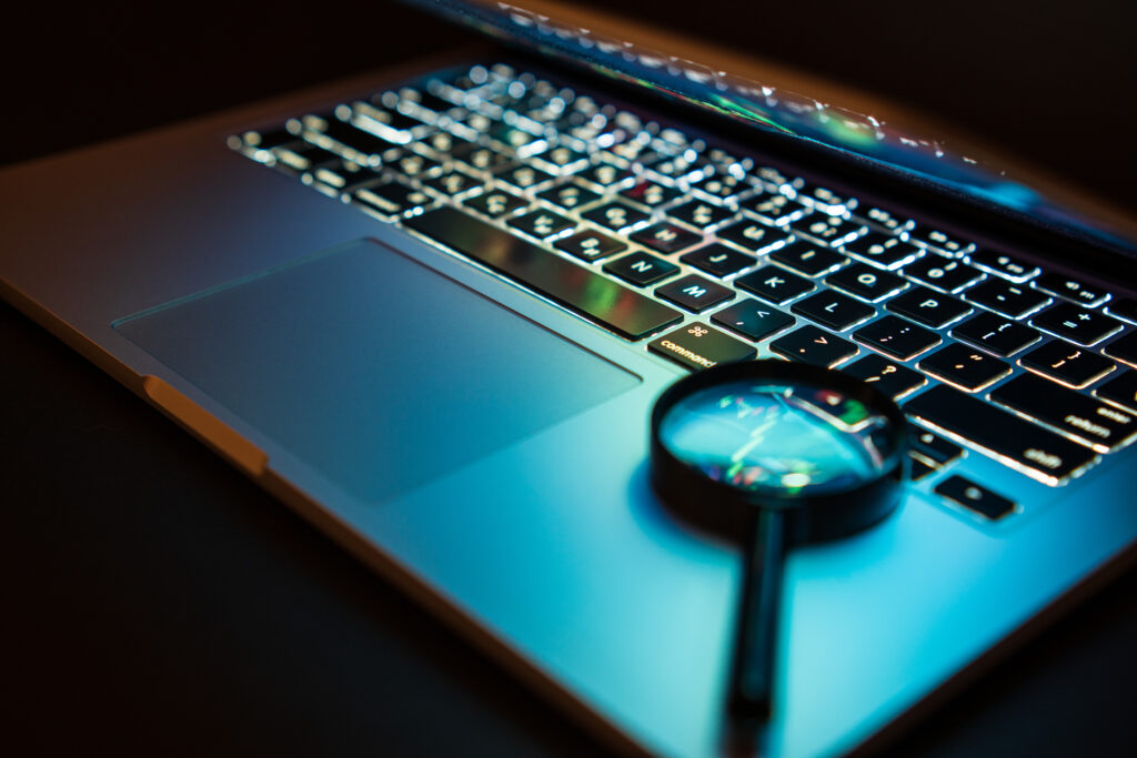 Modern laptop, isolated on black. Blurred foreground and background.